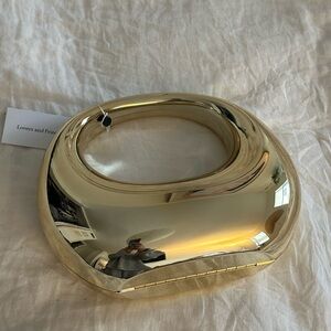 Gold clutch by Lovers + Friends